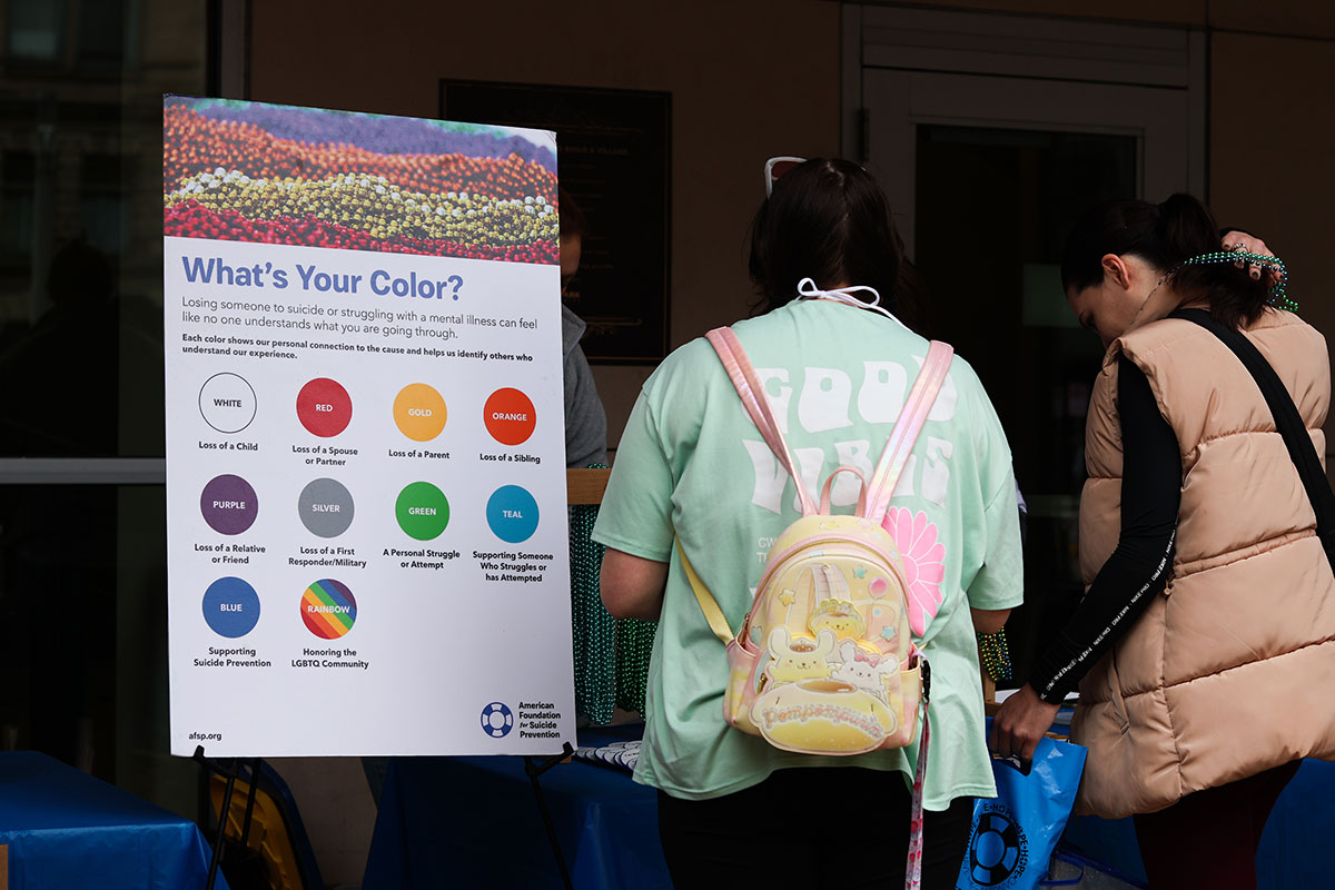 A sign indicates colors of beads participants could wear.