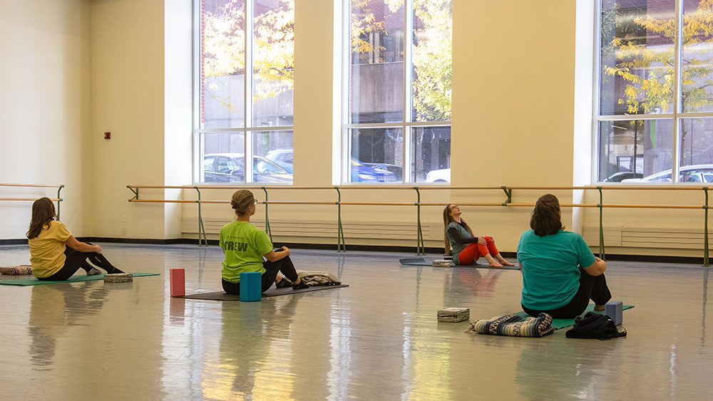 People participate in a yoga class.