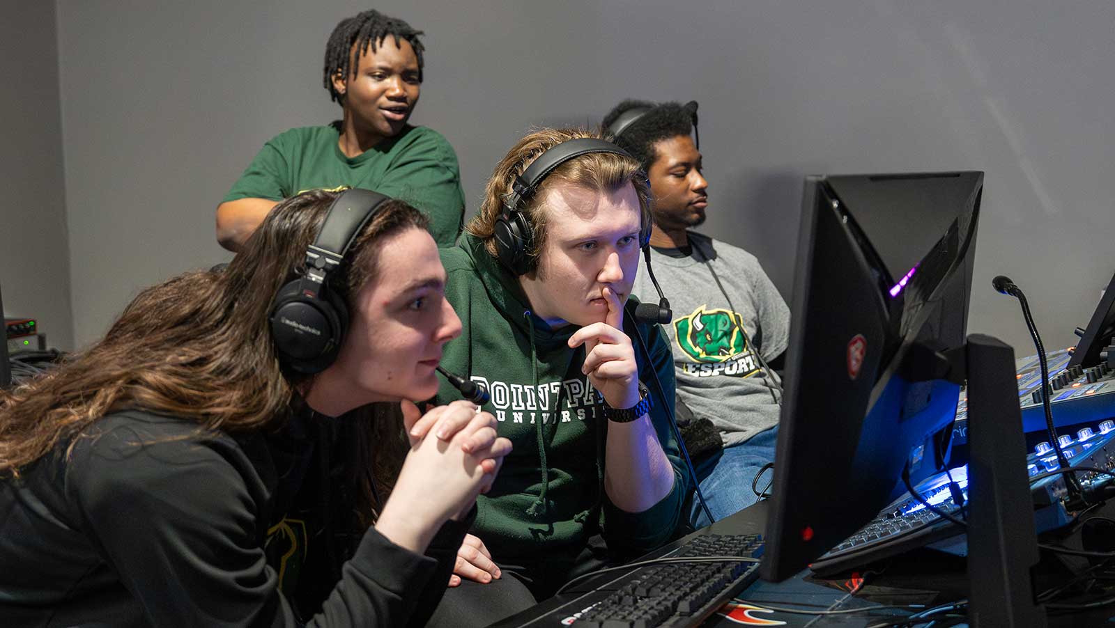 Point Park students sit at monitors and sound boards to run the streaming for a tournament.