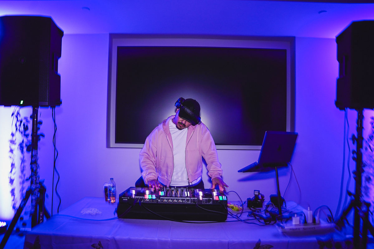 A DJ at the turntable at the prom.