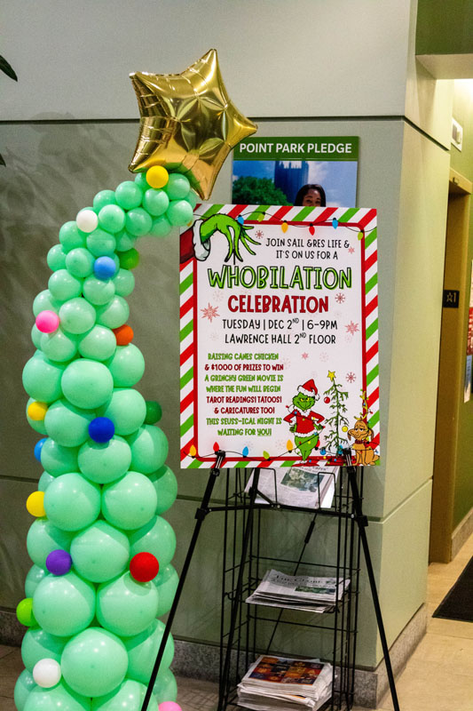 A sign welcomes people to the event.