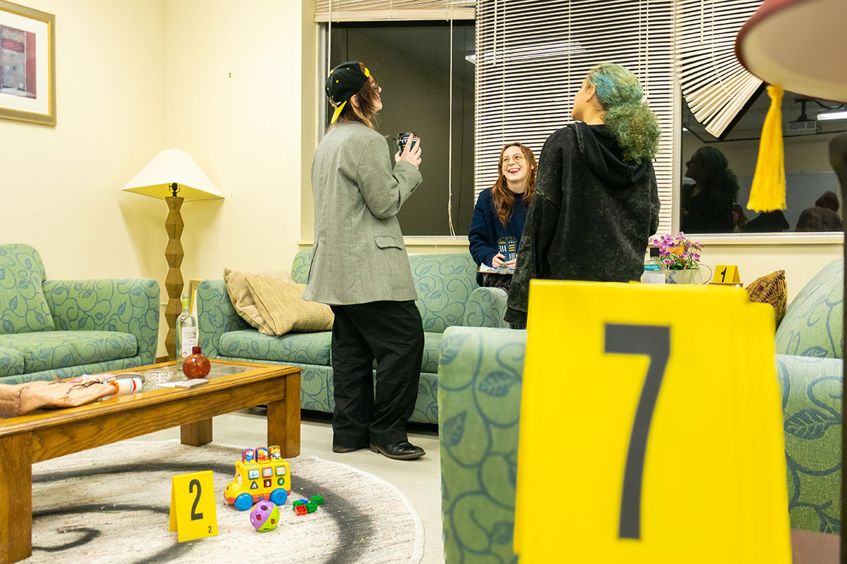 Students examine evidence in the CSI House.