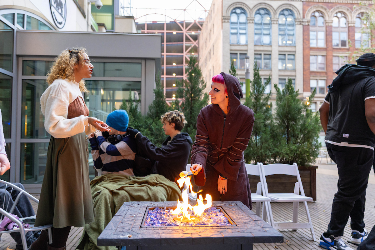 Students roast s'mores in Village Park. 