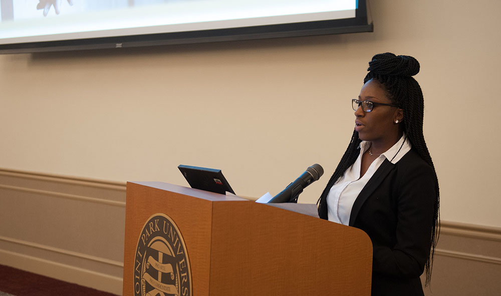 Pictured is a graduate student presenting research at Point Park University. Photo by Sarah Collins