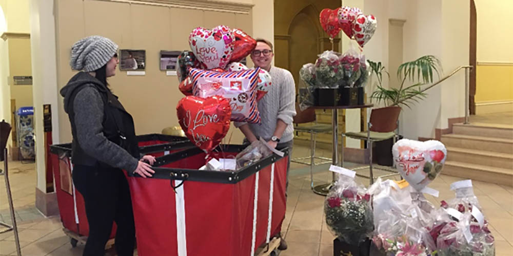 Point Park students Haley Barnes and Parker Werns sort deliveries in Lawrence Hall Lobby. Photo | Beth Turnbull 