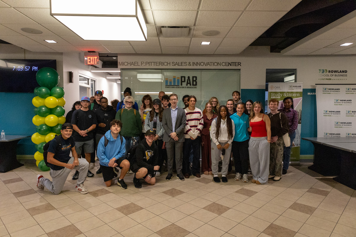 Geoff Anisman, deputy assistant secretary for Preservation and Global Platforms at the U.S. State Department's Bureau of Educational and Cultural Affairs, stands with Point Park University students in the Michael P. Pitterich Sales and Innovation Center on Sept. 24, 2026.