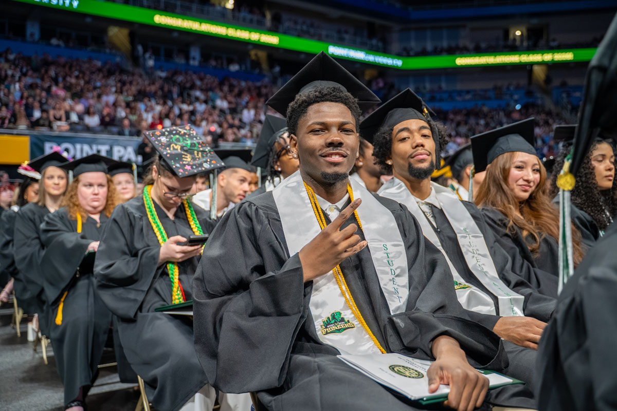 Student athletes sit in the row.
