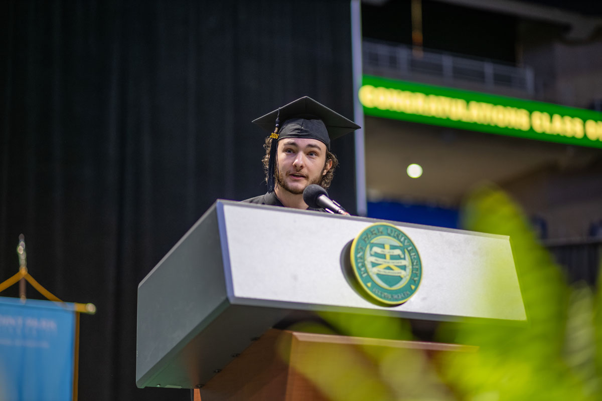 Christian Rangle speaks from the podium. 