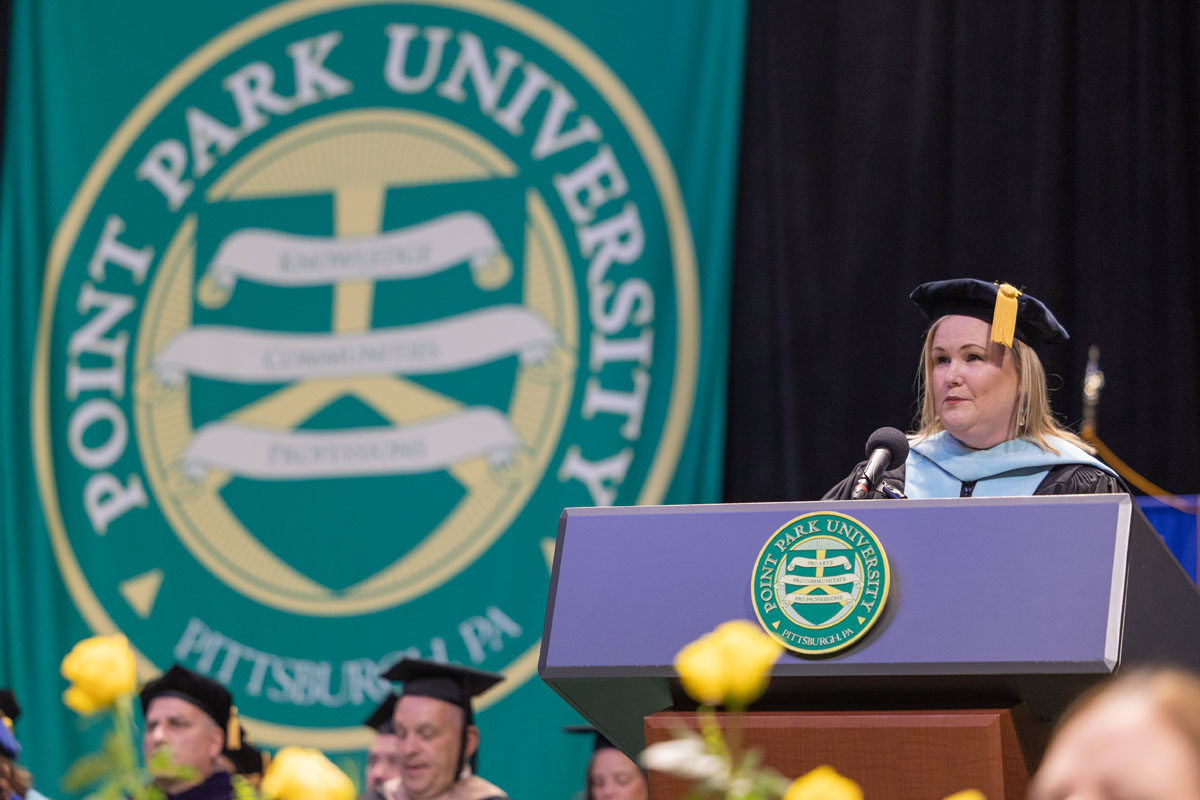 Shari Payne speaks from the podium.