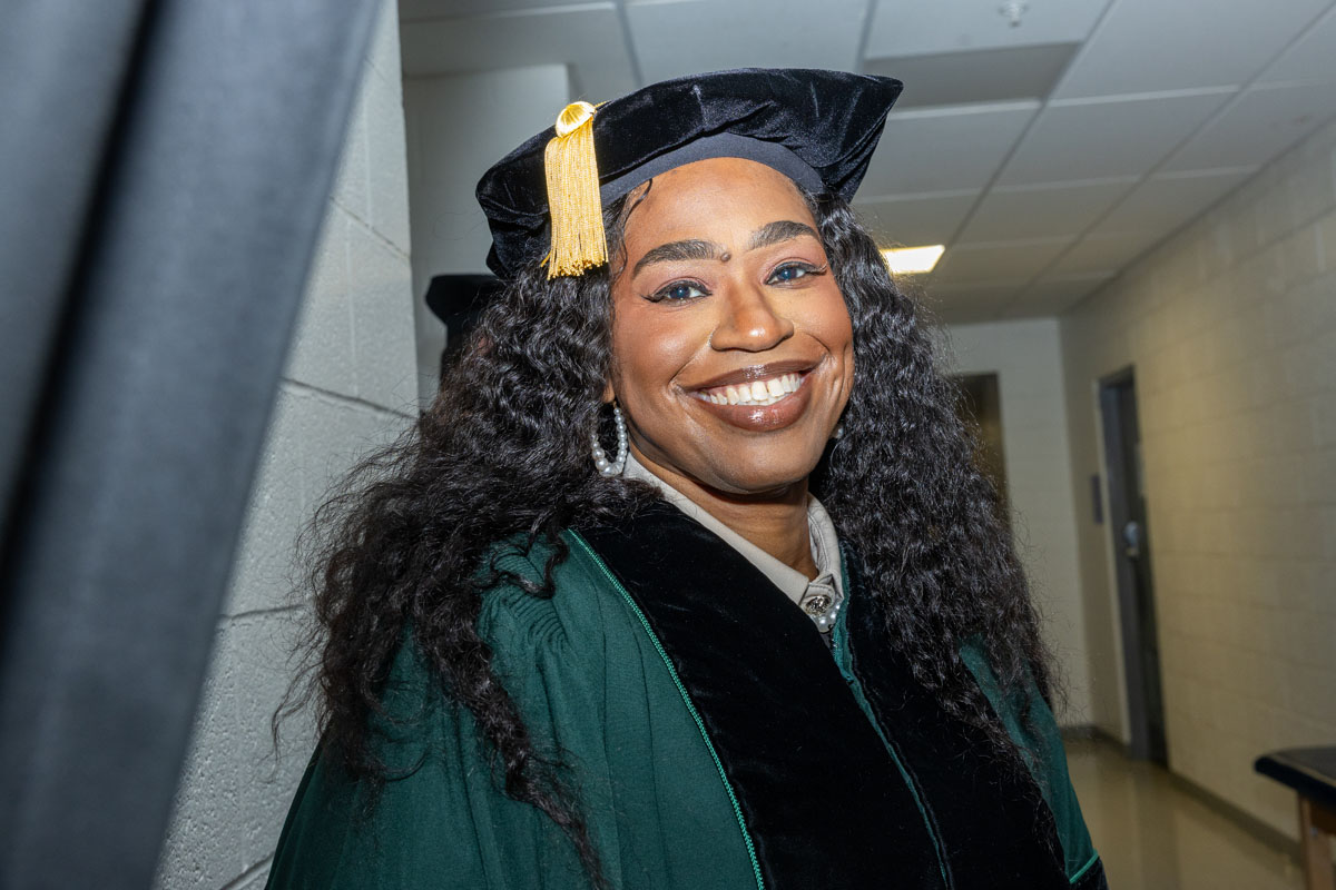A graduate smiles.