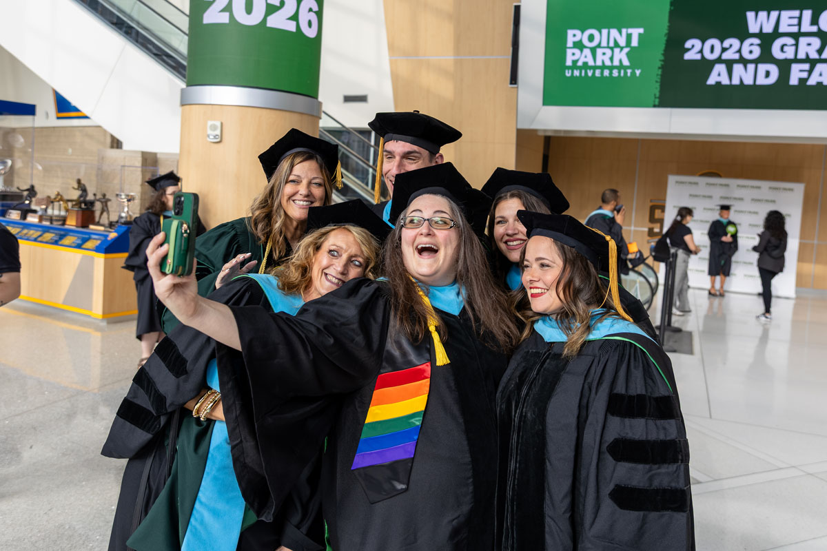 A group of students take a selfie.