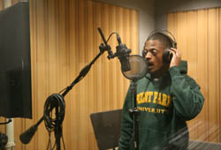 Pictured is a student in Point Park's sound studio.