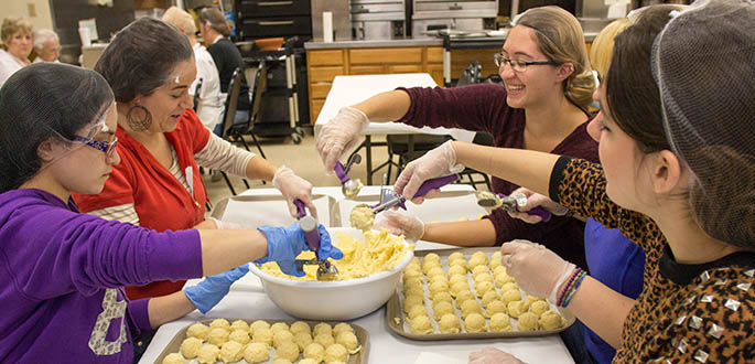 Students in the City-University life class make pirohi's at St. Mary's Ukranian Orthodox Church. Photo | Victoria A. Mikula