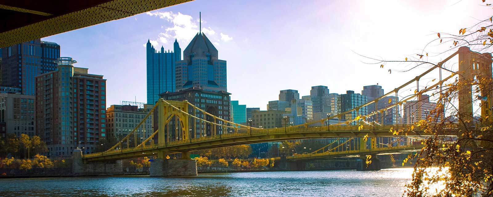 A bridge in front of the Pittsburgh skyline.