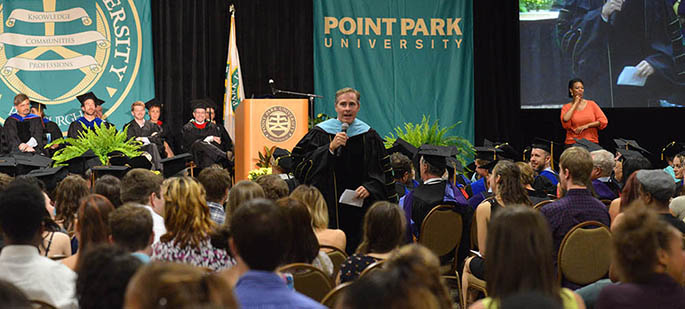 Paul Hennigan, president of Point Park University, talks with new freshmen and transfer students at Convocation on Aug. 24, 2012.