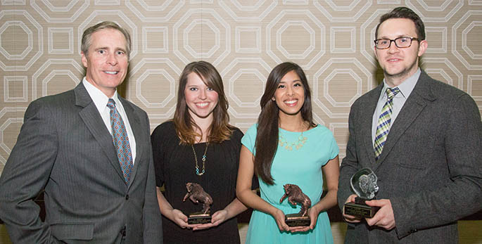 Point Park President Paul Hennigan stands with: (l-r) Chelsea Behanna, Outstanding Student Leader; Sara Mahmood, Outstanding Graduating Senior; and Justin Karter, Outstanding Graduate Student. | Photo by John Altdorfer