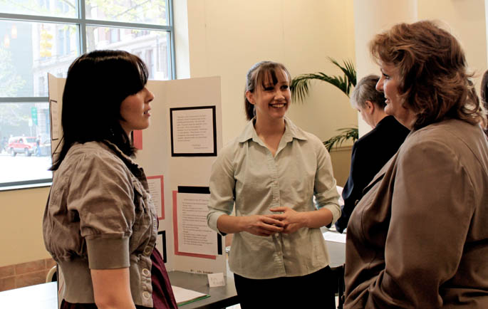 Seniors Jenni Anderson and Kiri Richards discuss their work with English Prof. P.K. Weston. | Photograph by Camelia Montoy.