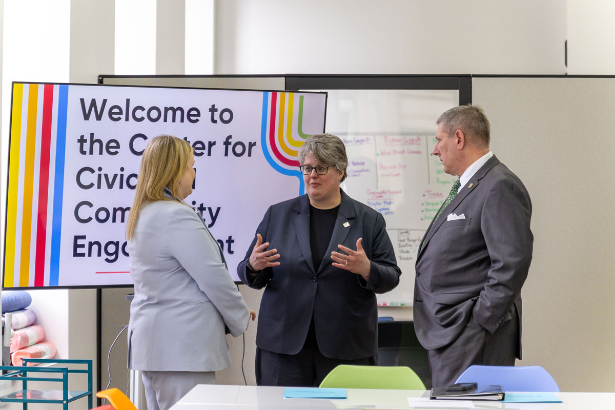 Provost Shari Payne, Secretary of Education Carrie Rowe and President Chris Brussalis, talk.