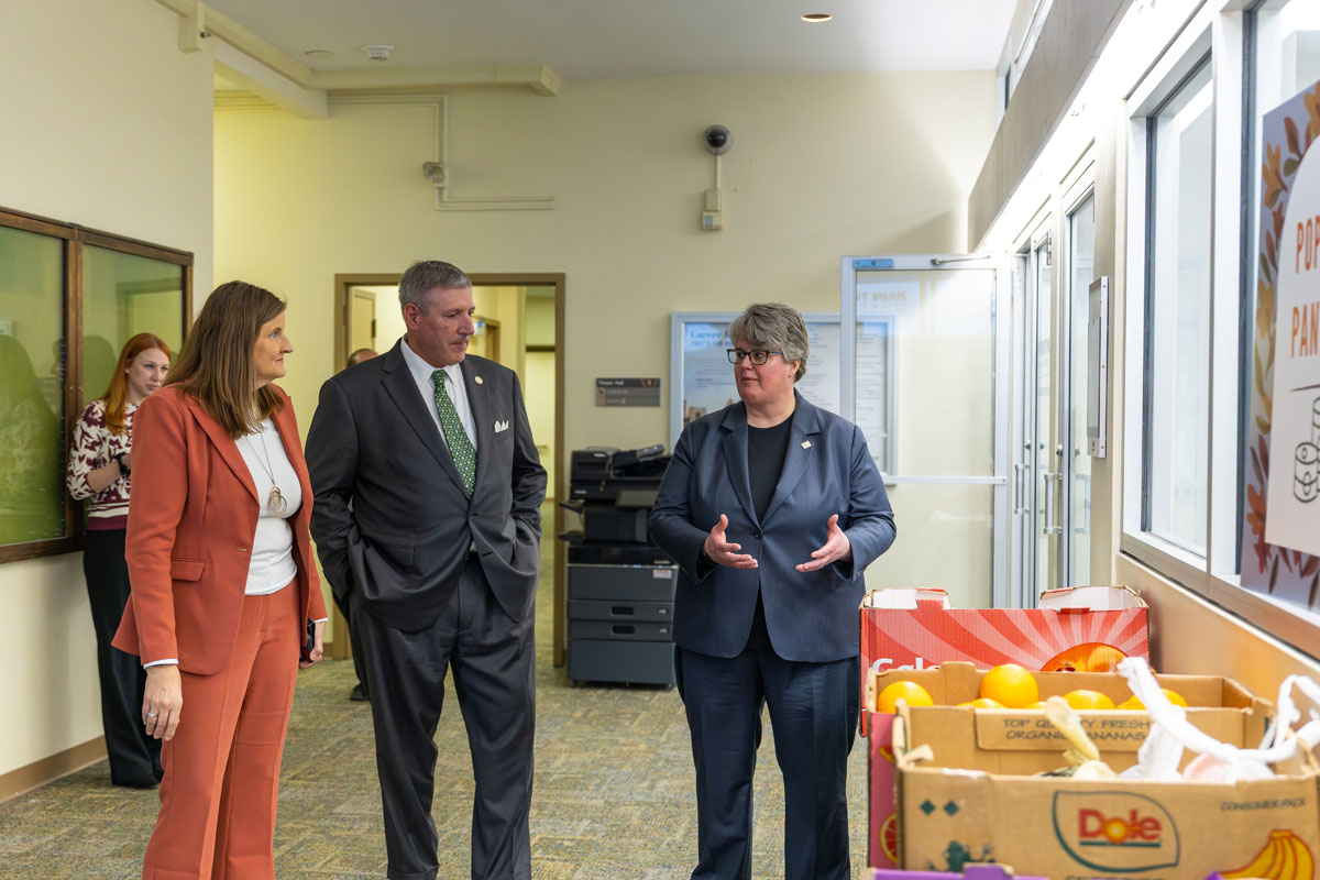Heather Fiedler, Austin Davis and Carrie Rowe in the hallway outside of the Corner Store.