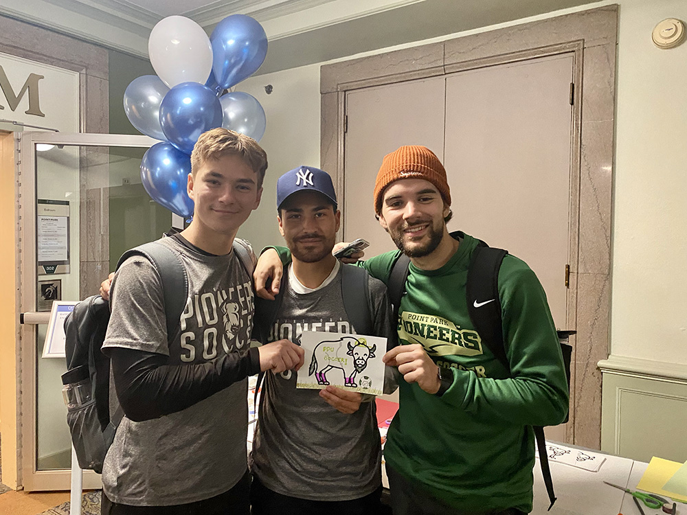 Members of the men's soccer team stopped by the coloring station during the Pioneer Pause.