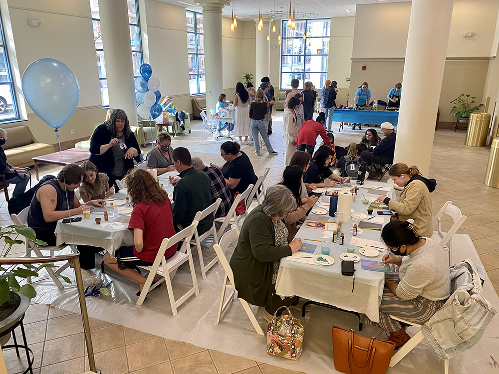 Students, staff and faculty take part in activities in the Lawrence Hall lobby. Photo by Nicole Chynoweth. 