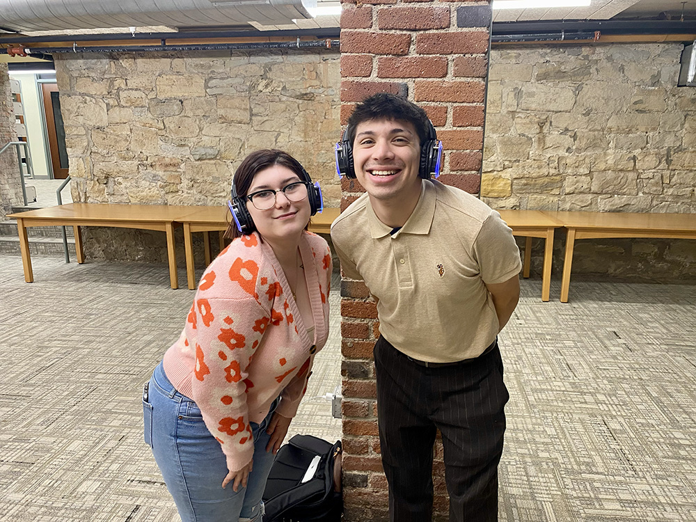 Two students pose for a photo at the Pioneer Pause silent disco. Photo by Nicole Chynoweth.