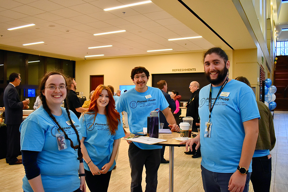 Point Park staff pose for a photo during the Pioneer Pause welcome breakfast. Photo by Nicole Chynoweth. 