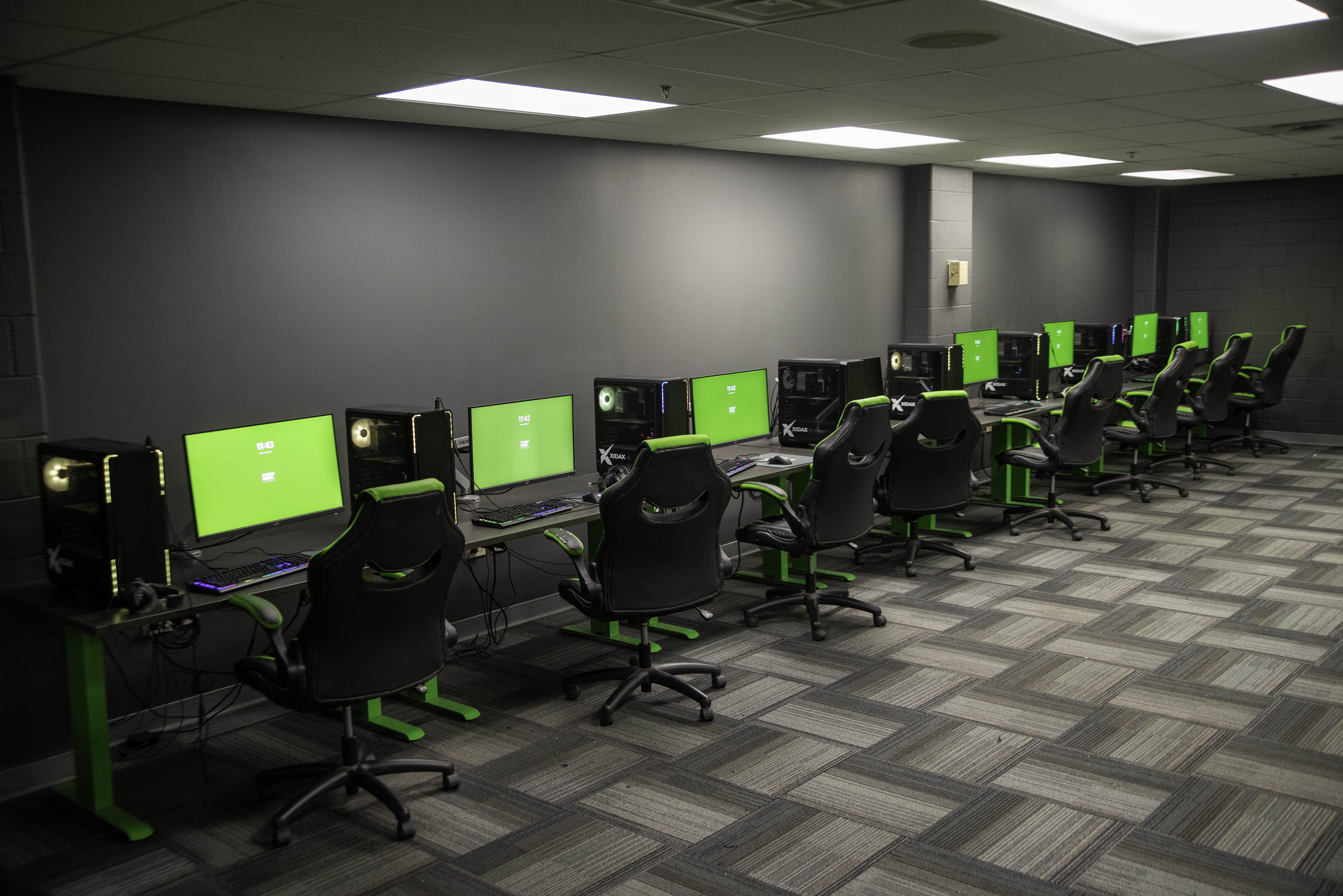 Esports PCs line a wall.