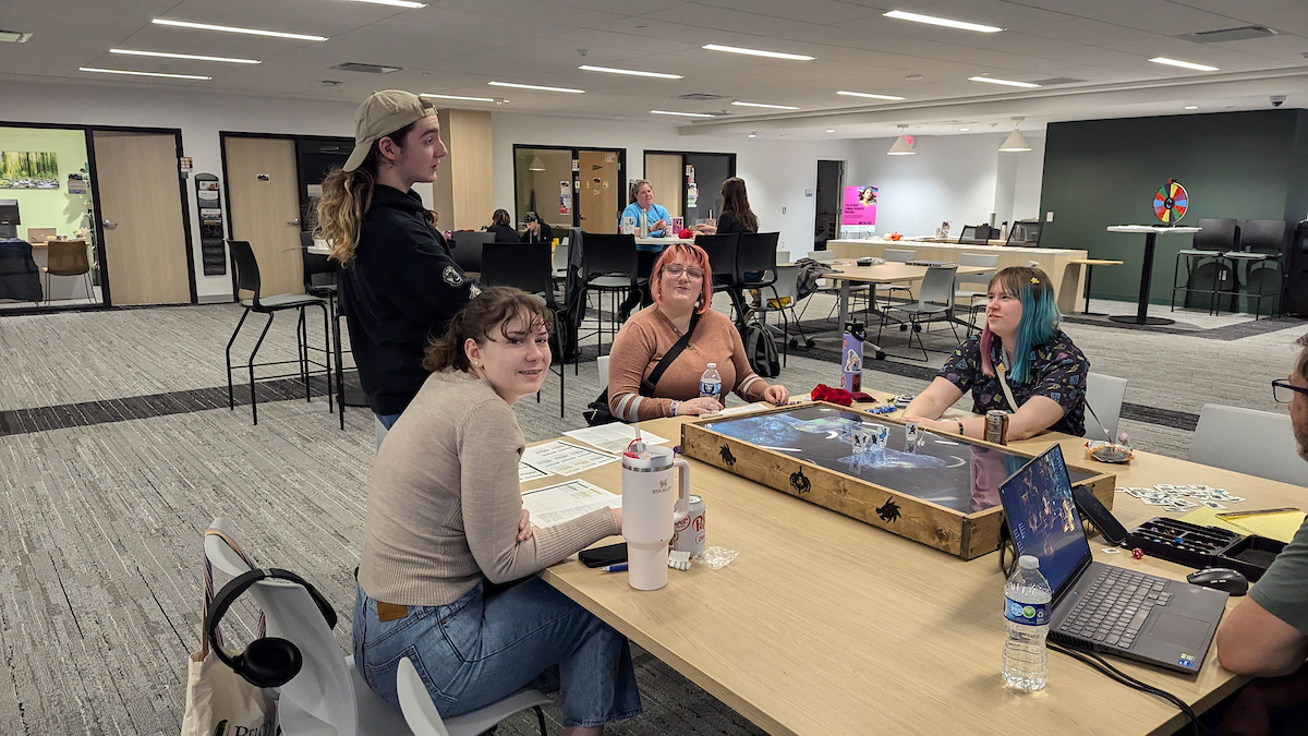 Staff and students play a role playing game.
