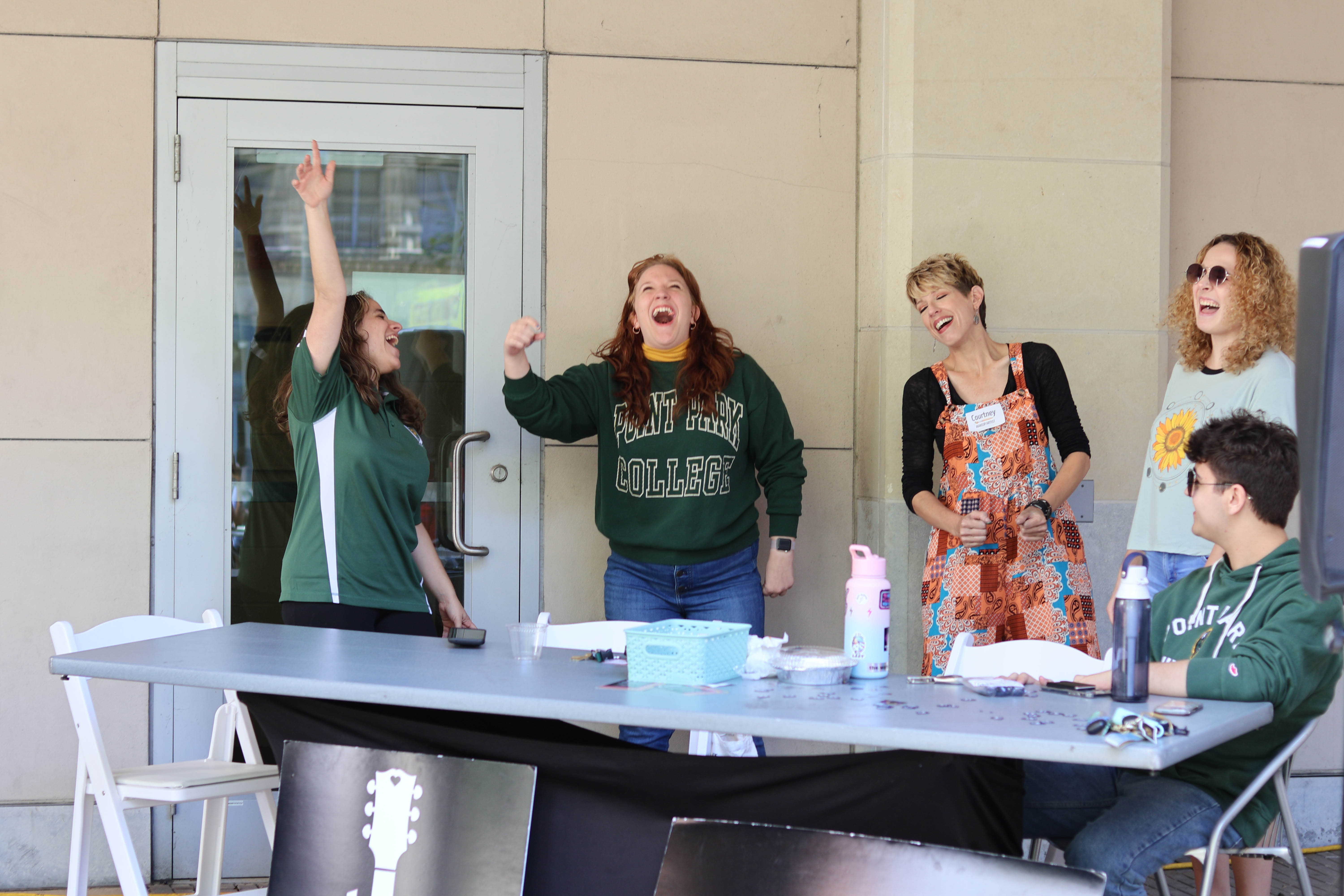 Students Celebrating the Pioneer Pause in Village Park