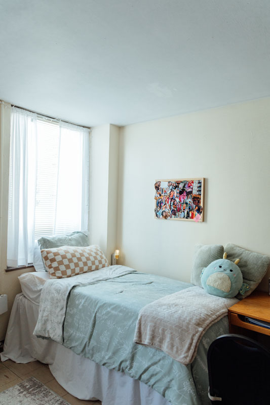 A bed in a dorm room.