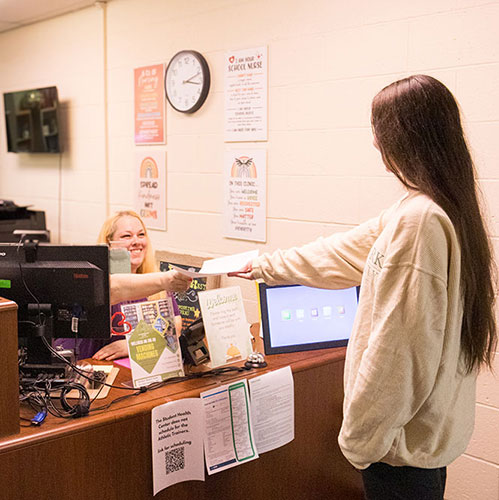 A student checks in at the Student Health Center.