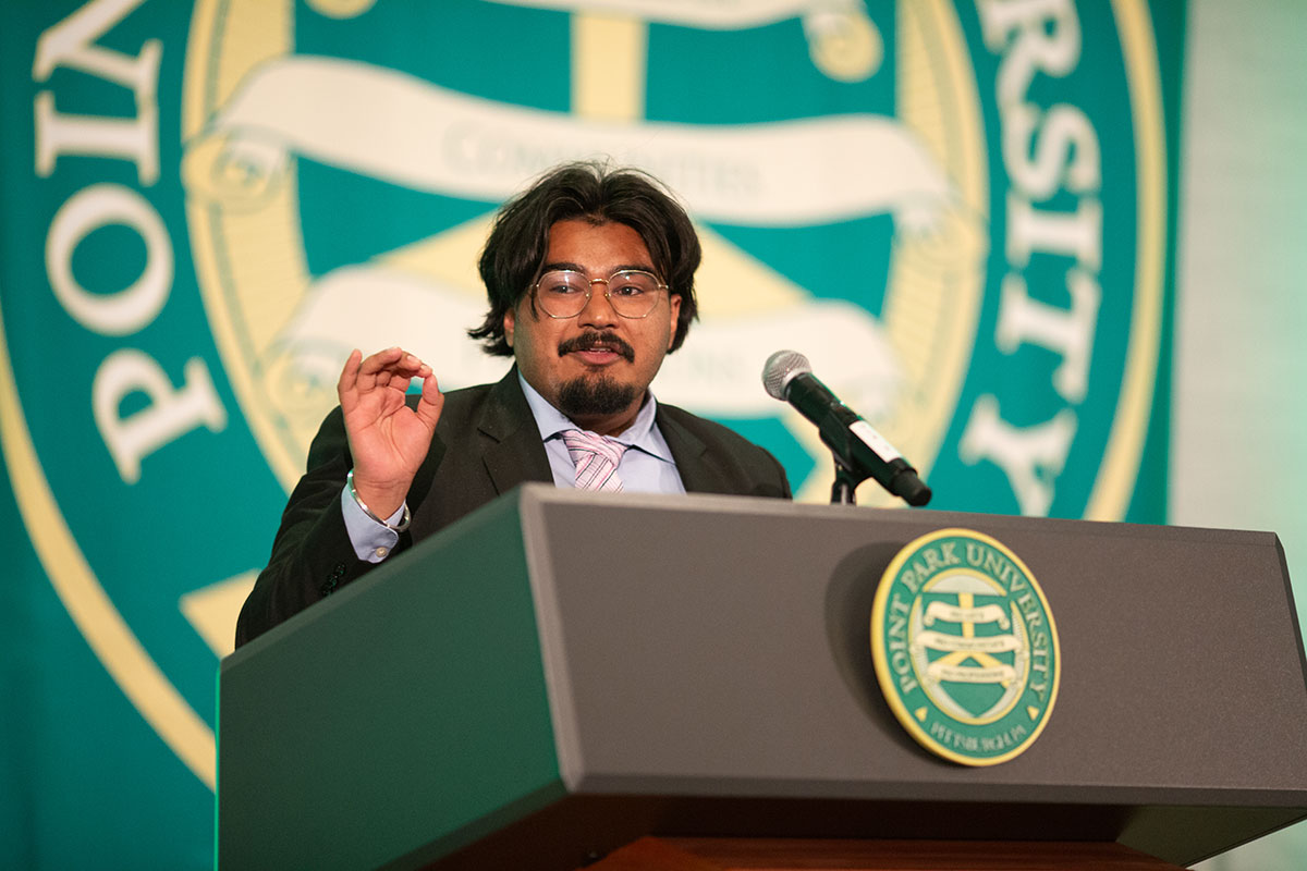 A man stands at a podium.