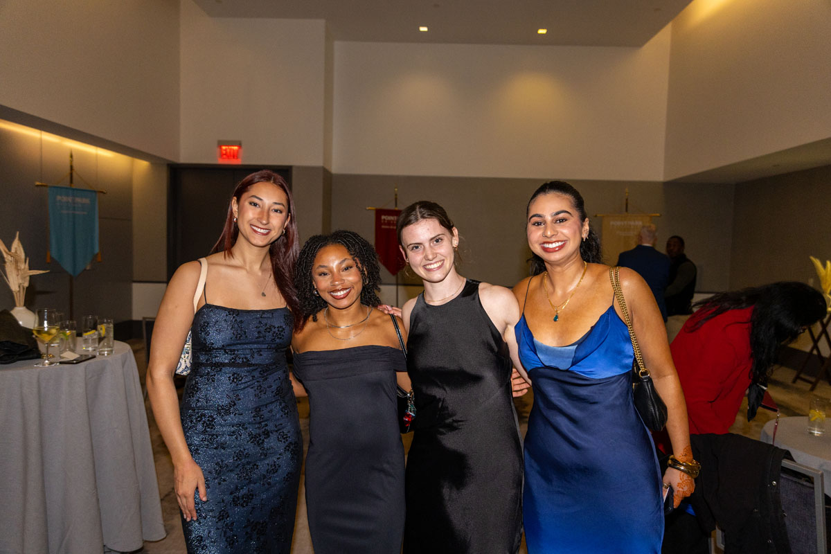 Four female students pose for a photo. 