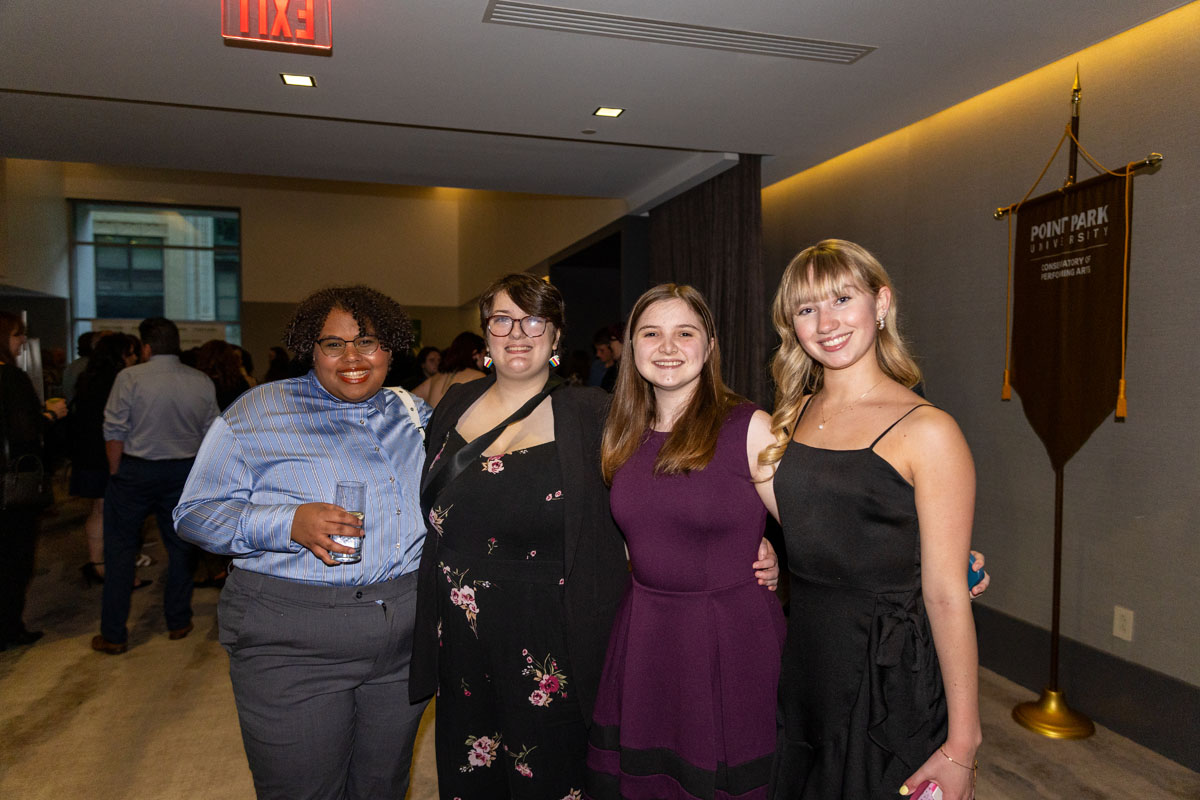 Four students pose for a photo.