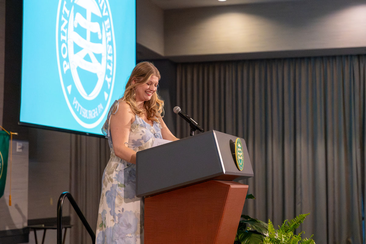 Cindy Pietrakowski speaks from a podium. 