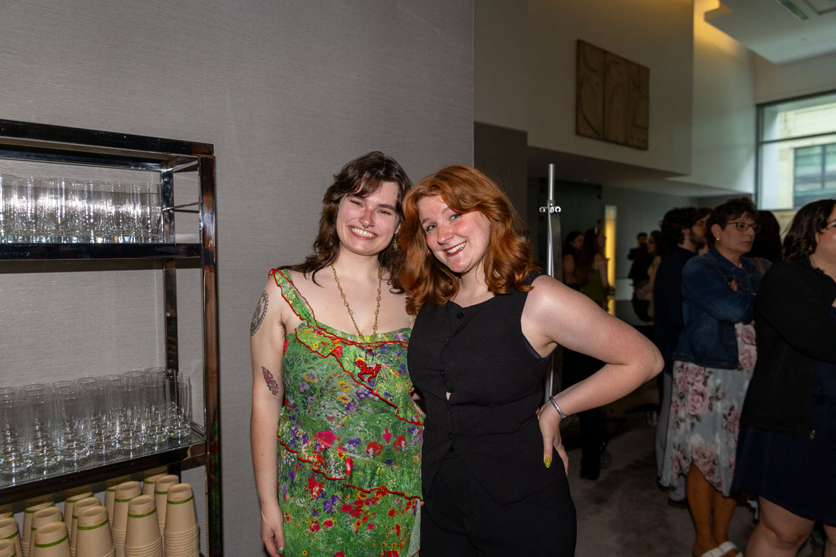 Two students pose for a photo.
